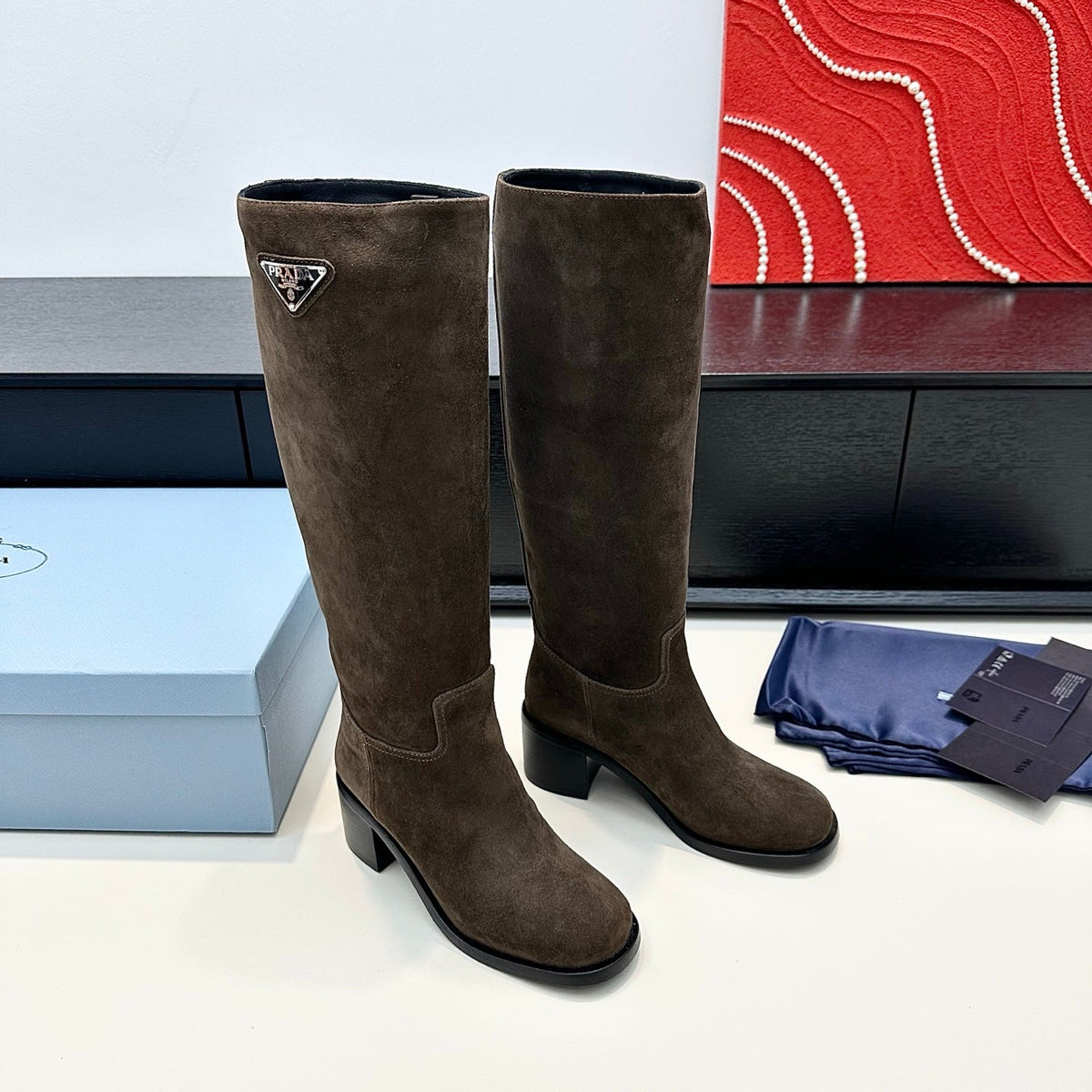 PRADA 25S HIGH-CUT BOOTS 55 MM IN EARTH BROWN SUEDE