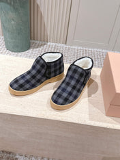MIUMIU 25S SLIP-ON BOOTIES IN BLACK AND BLUE WOOL WITH SHEARLING