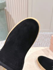 MIUMIU 25S SLIP-ON BOOTIES IN BLACK SUEDE WITH FAUX SHEARLING