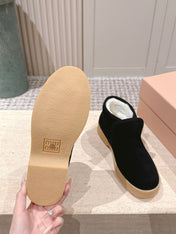 MIUMIU 25S SLIP-ON BOOTIES IN BLACK SUEDE WITH FAUX SHEARLING