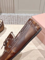 MIUMIU 25S BOAT SHOES IN SIENNA BROWN BLEACHED CALFSKIN WITH SHEARLING
