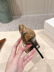 YSL 26S POINTED-TOE PUMPS 100 MM IN TRANSPARENT BROWN TPU WITH PYTHON-TRIMMED
