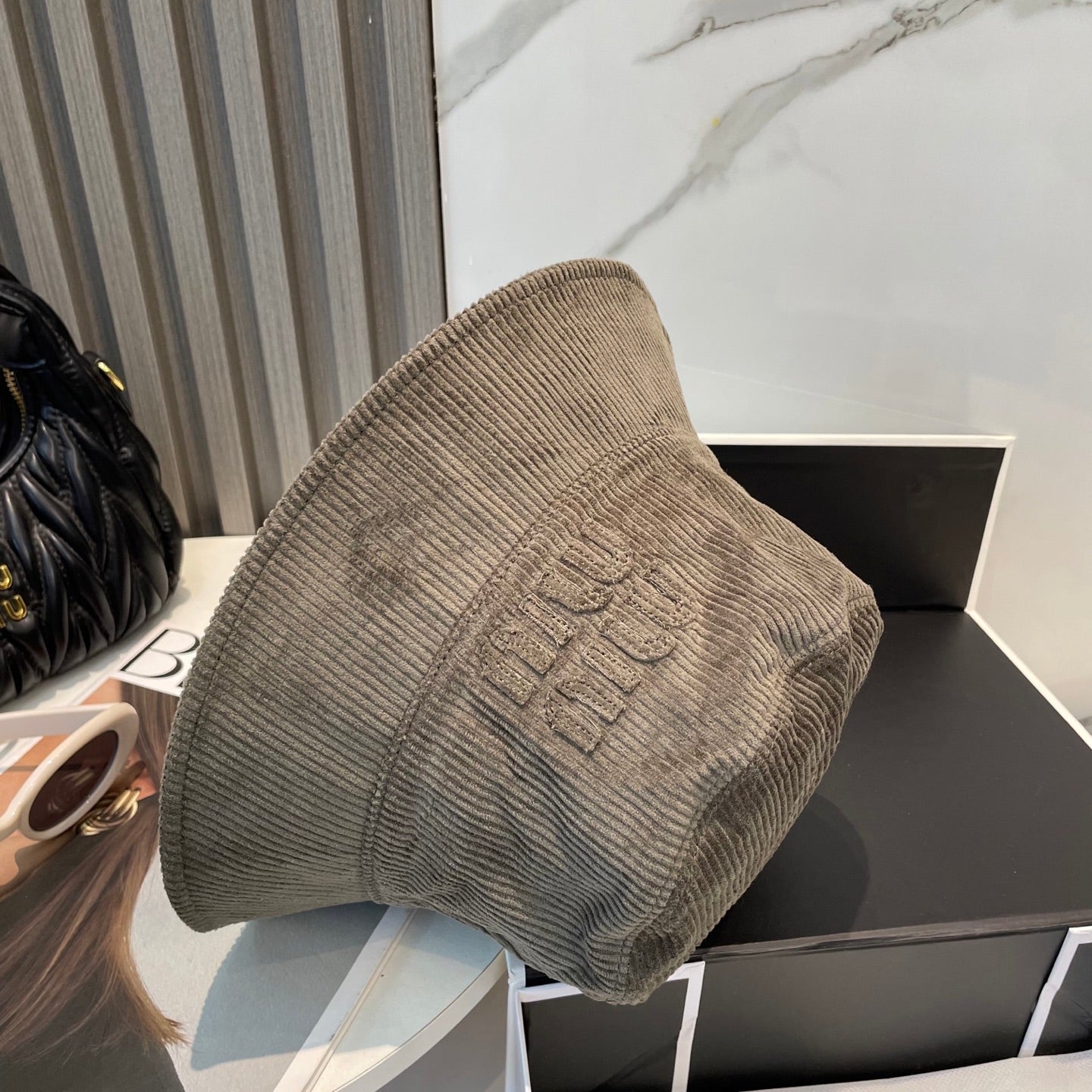 MM BUCKET IN MUTED BROWN VELVET WITH LOGO