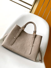 LV 25S BABYLONE TOTE BAG 32 IN TOURTERELLE GREY CALFSKIN GOLD HARDWARE