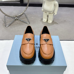 PRADA 25S THICK-SOLE LOAFERS 60 MM IN COGNAC BROWN CALFSKIN