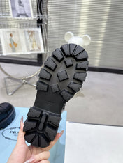 PRADA 25S WARRIOR BOOTS IN BLACK CALFSKIN