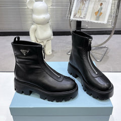 PRADA 25S ZIP-UP ANKLE BOOTS IN BLACK CALFSKIN