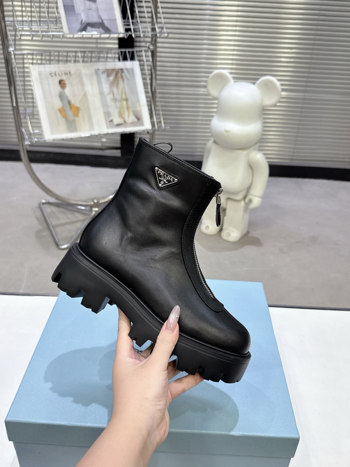 PRADA 25S ZIP-UP ANKLE BOOTS IN BLACK CALFSKIN