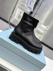 PRADA 25S ZIP-UP ANKLE BOOTS IN BLACK CALFSKIN