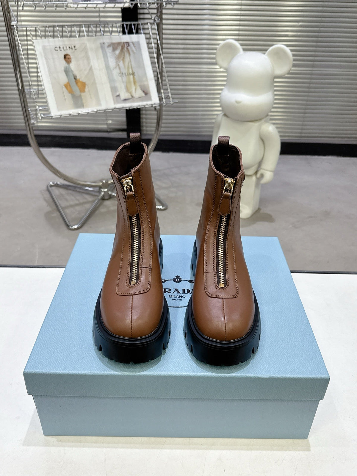 PRADA 25S ZIP-UP ANKLE BOOTS IN BROWN CALFSKIN