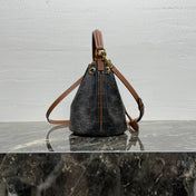 CLARA BAG 19 IN BLACK TRIOMPHE CANVAS AND BROWN CALFSKIN TRIM