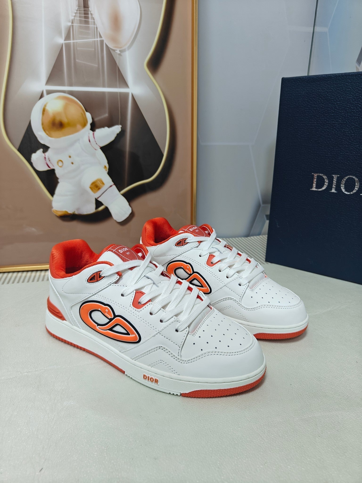 DIOR 26S LOW-TOP SNEAKER IN WHITE AND ORANGE CALFSKIN
