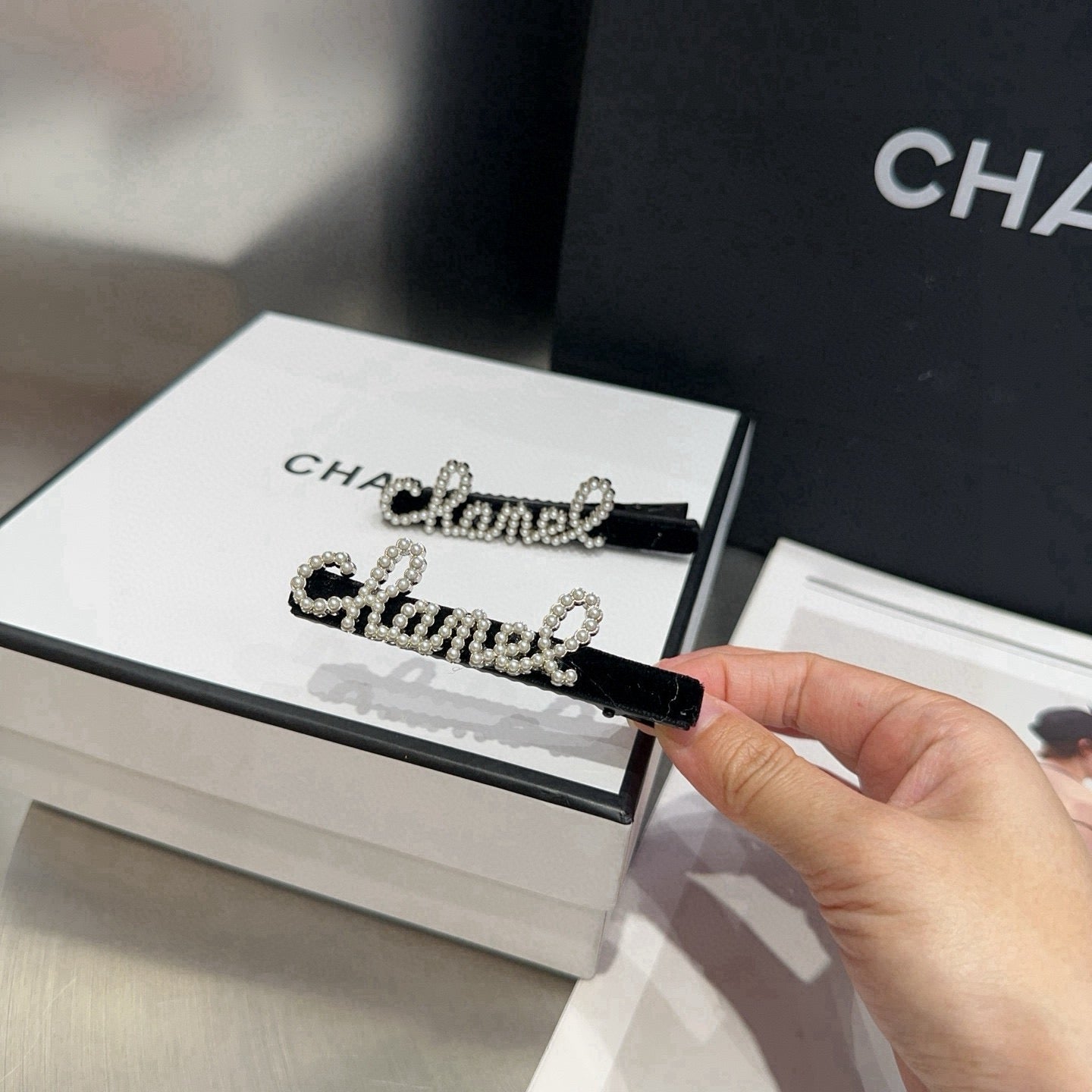 CHANEL 26S BOW HAIR CLIP IN BLACK RHINESTONE SCRIPT 505309
