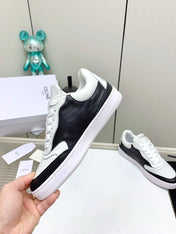 SNEAKER WITH TRIOMPHE IN BLACK AND WHITE CALFSKIN