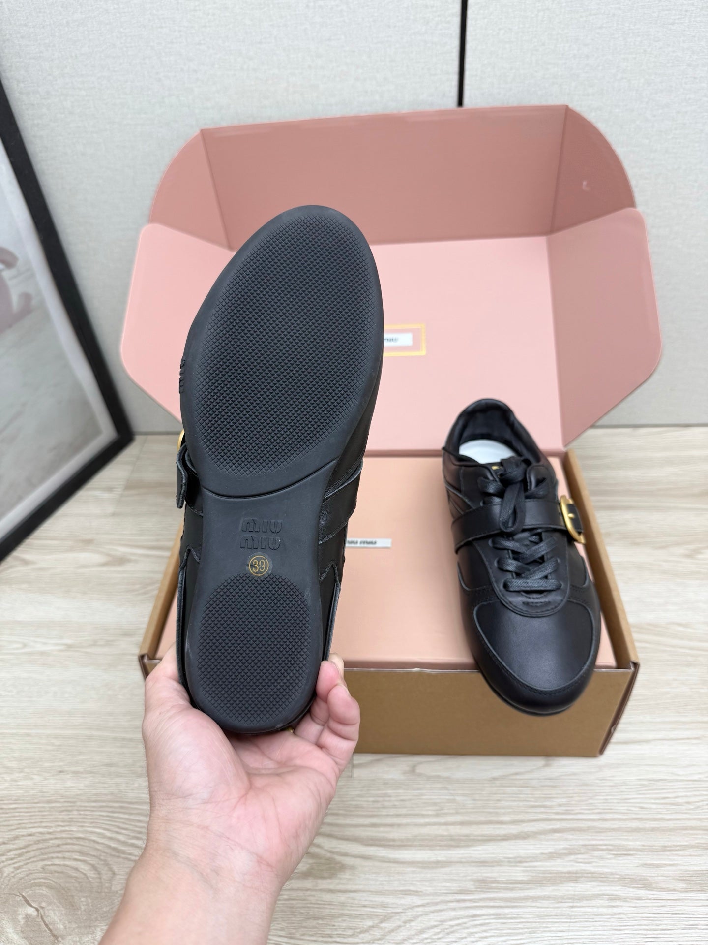 MIUMIU 26S BUCKLE SNEAKERS IN BLACK CALFSKIN WITH GOLD HARDWARE