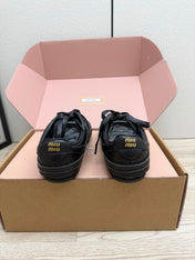 MIUMIU 26S BUCKLE SNEAKERS IN BLACK CALFSKIN WITH GOLD HARDWARE