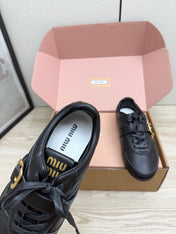 MIUMIU 26S BUCKLE SNEAKERS IN BLACK CALFSKIN WITH GOLD HARDWARE
