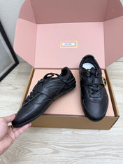 MIUMIU 26S BUCKLE SNEAKERS IN BLACK CALFSKIN WITH GOLD HARDWARE