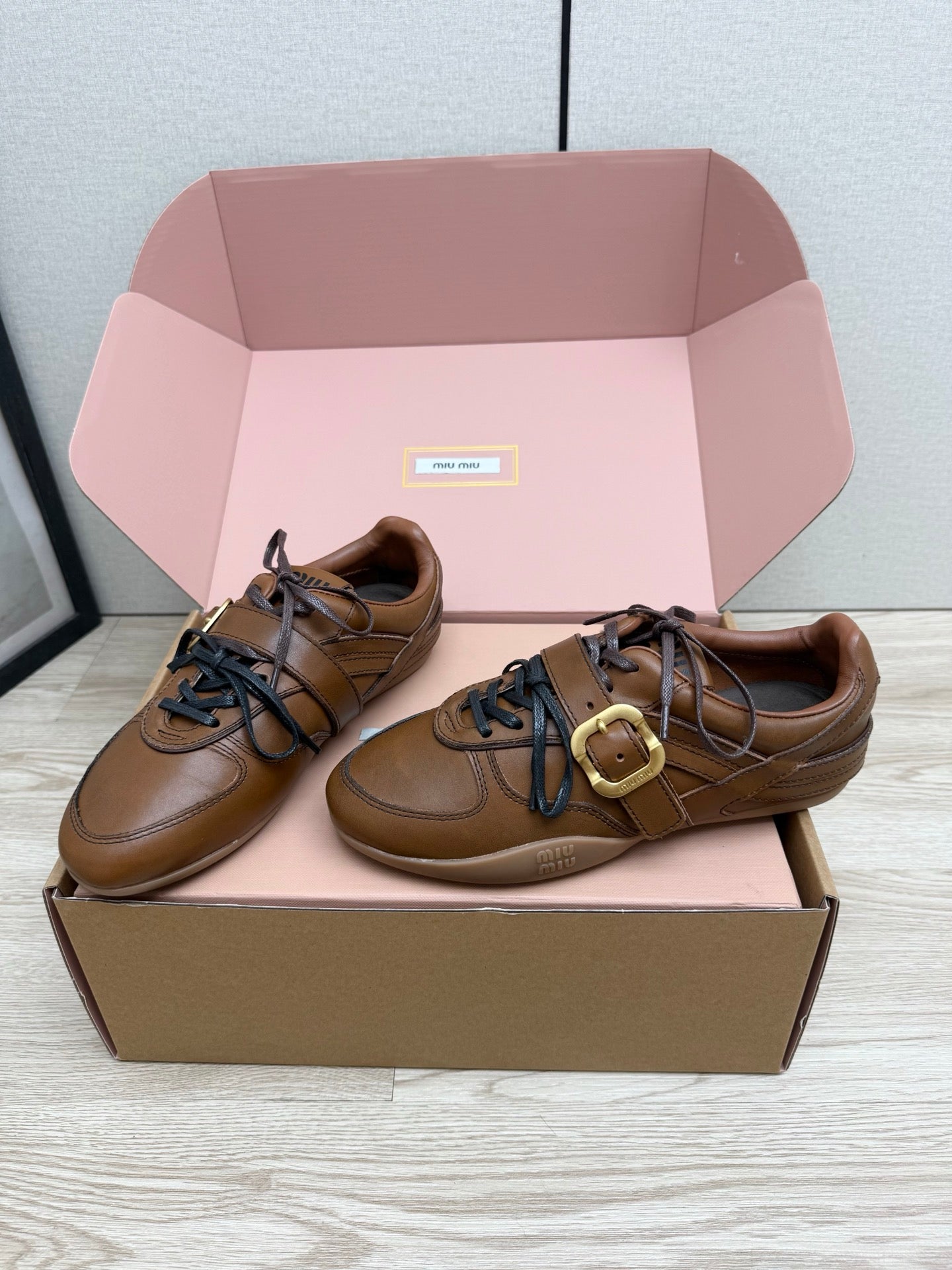 MIUMIU 26S BUCKLE SNEAKERS IN BROWN CALFSKIN WITH GOLD HARDWARE