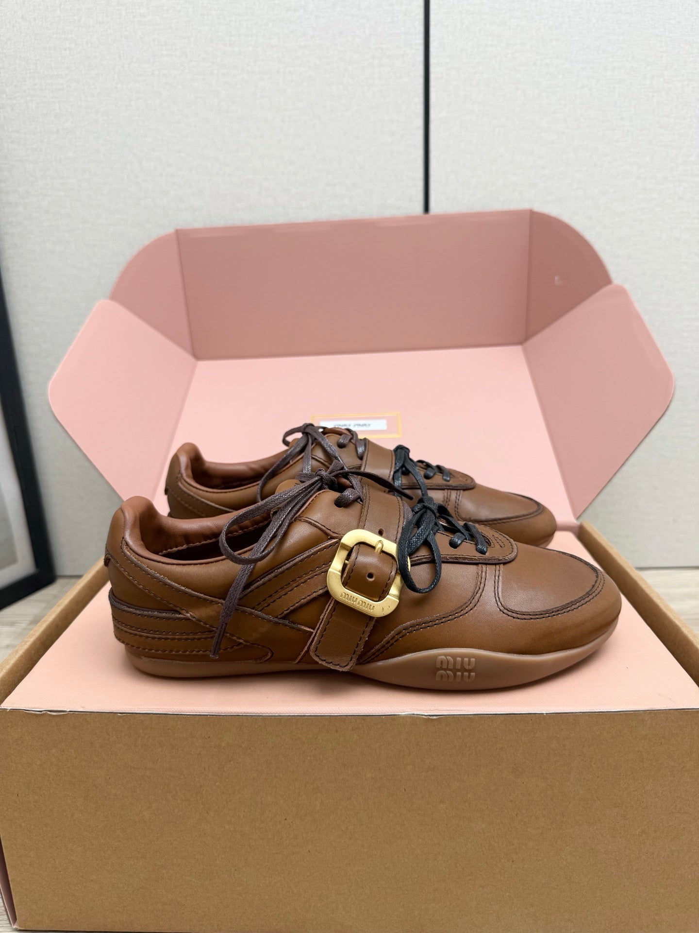 MIUMIU 26S BUCKLE SNEAKERS IN BROWN CALFSKIN WITH GOLD HARDWARE