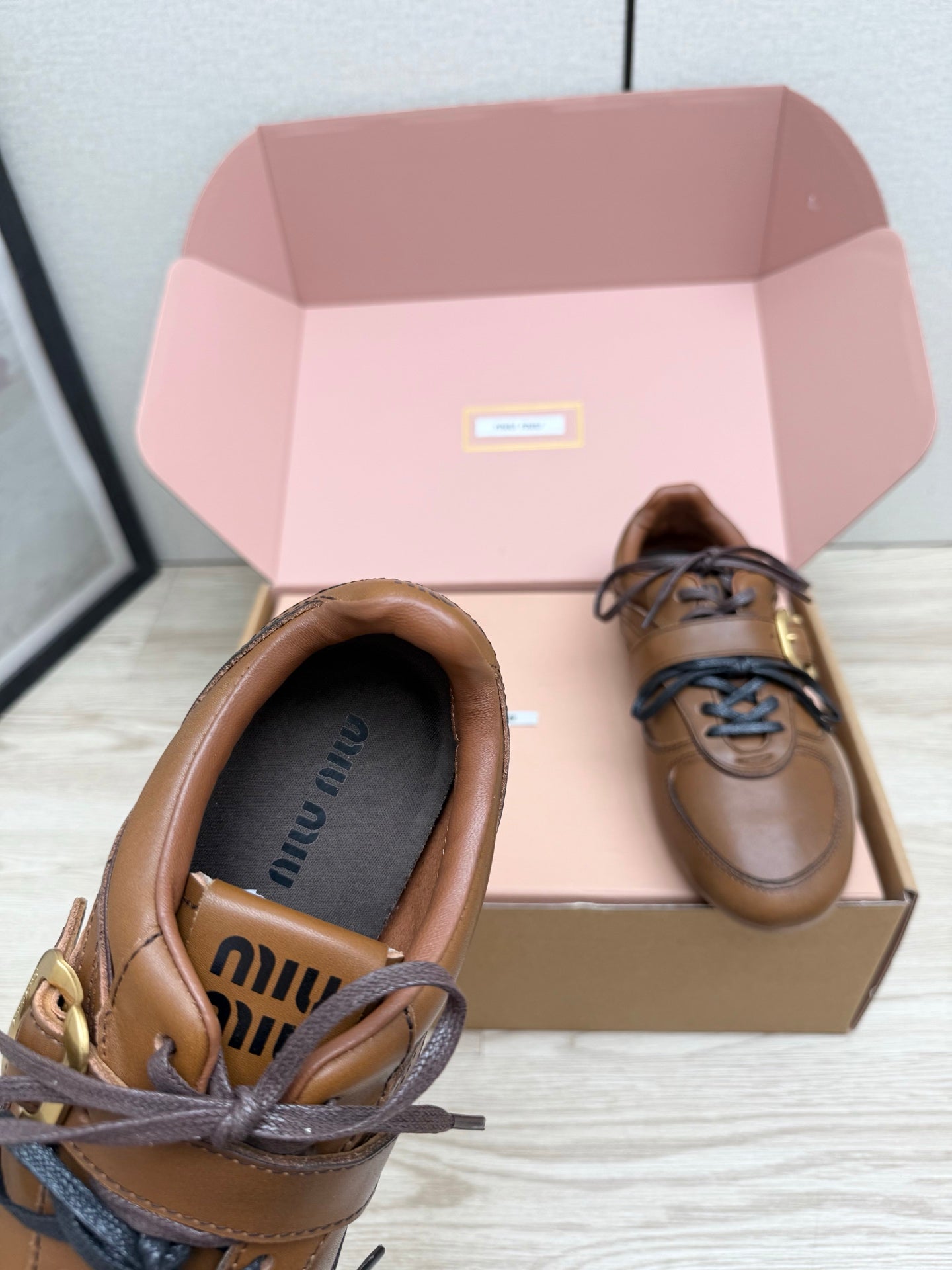 MIUMIU 26S BUCKLE SNEAKERS IN BROWN CALFSKIN WITH GOLD HARDWARE