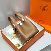 HERMES 25S PICOTIN LOCK 18 IN BURNT CARAMEL CALFSKIN GOLD HARDWARE