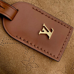 CARRYALL PM 29 IN CIDER BROWN MONOGRAM PERFORATED SUEDE AND WHITE SHEARLING TRIM