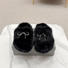 BALENCIAGA 25S SOFT FUR SLIPPERS IN BLACK FUR WITH RHINESTONE BOW