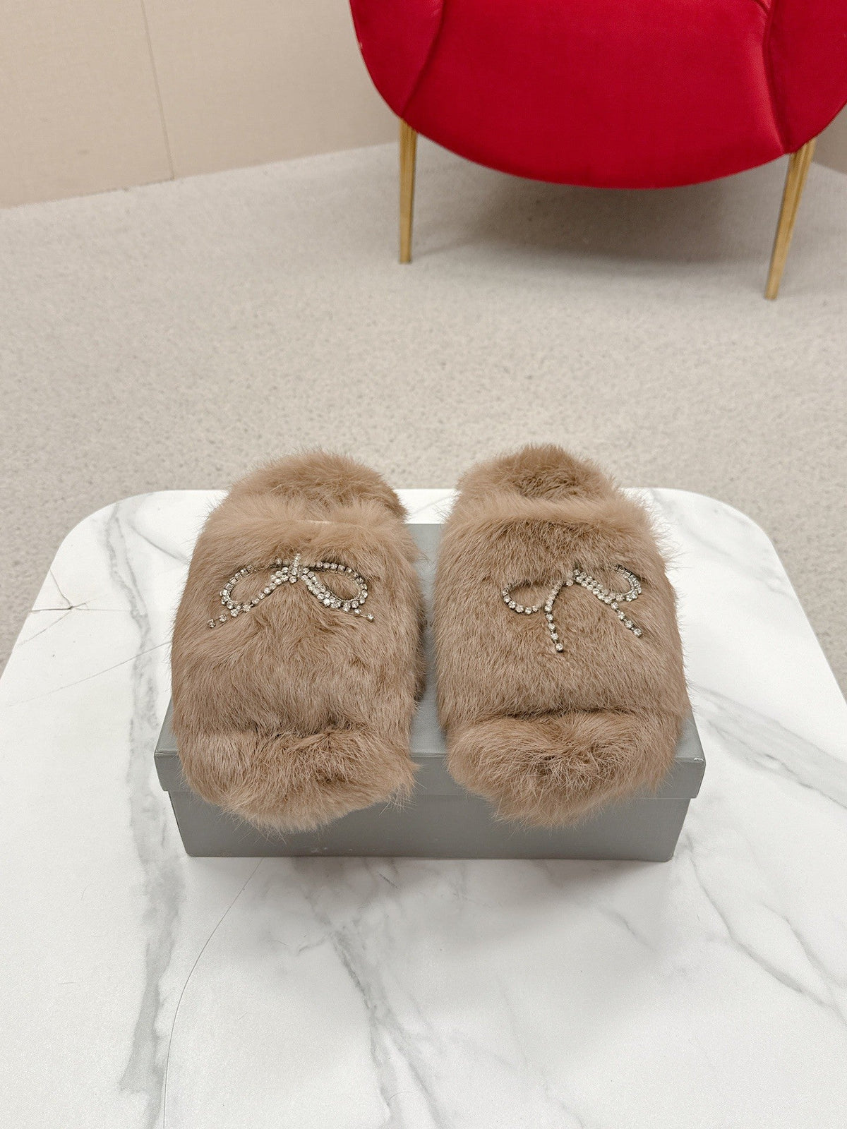 BALENCIAGA 25S SOFT FUR SLIPPERS IN LIGHT BROWN FUR WITH RHINESTONE BOW
