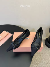 MIUMIU 26S HIGH-HEEL IN BLACK MESH AND LAMBSKIN WITH BOW