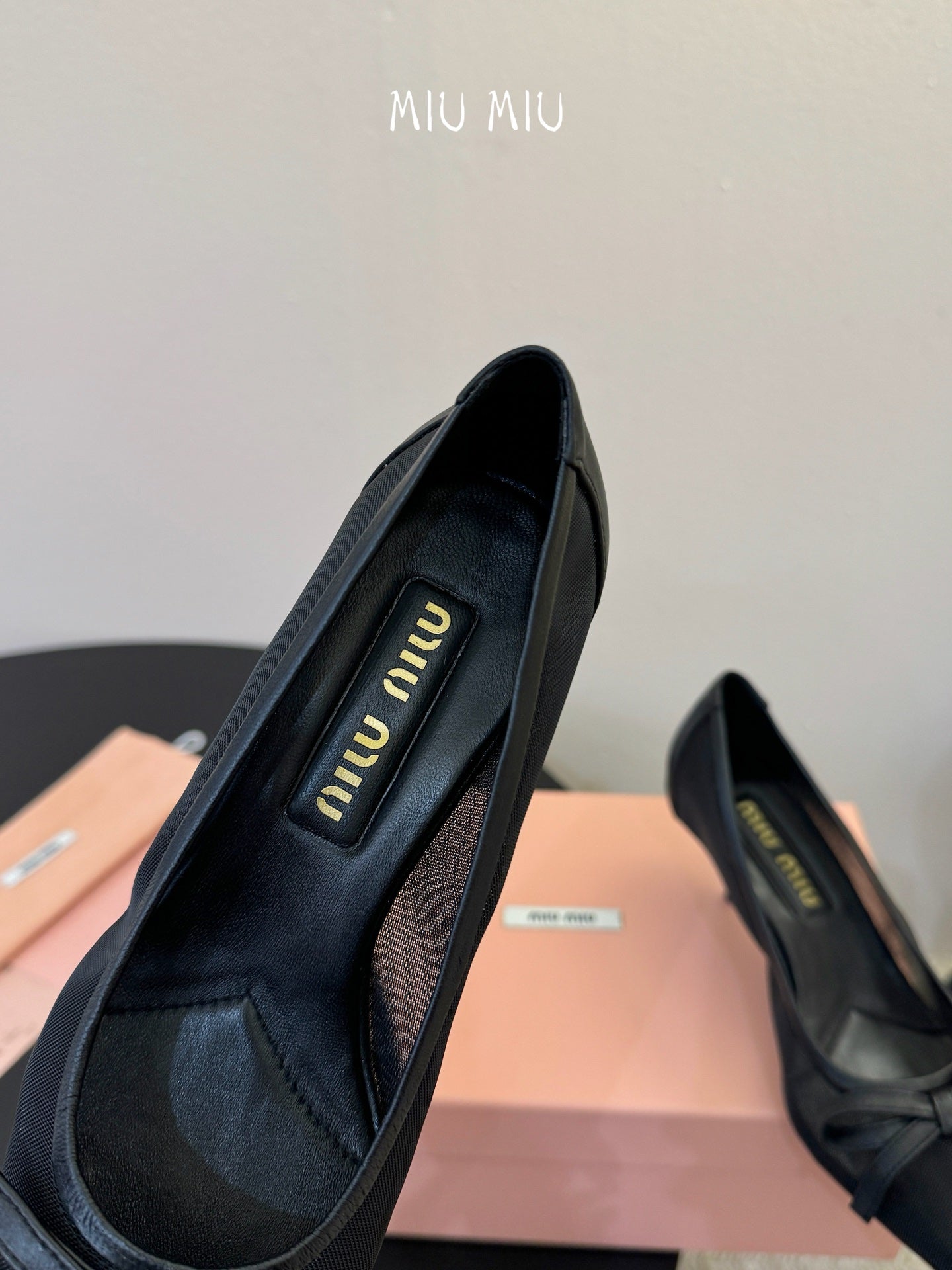 MIUMIU 26S HIGH-HEEL IN BLACK MESH AND LAMBSKIN WITH BOW