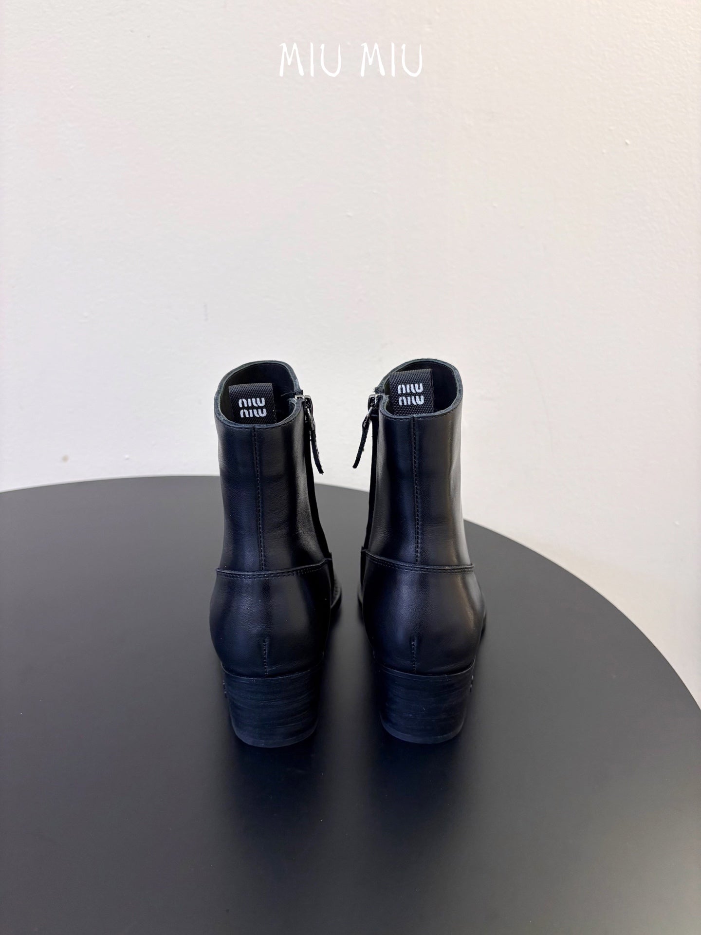 MIUMIU 26S WESTERN ANKLE BOOTS IN BLACK CALFSKIN