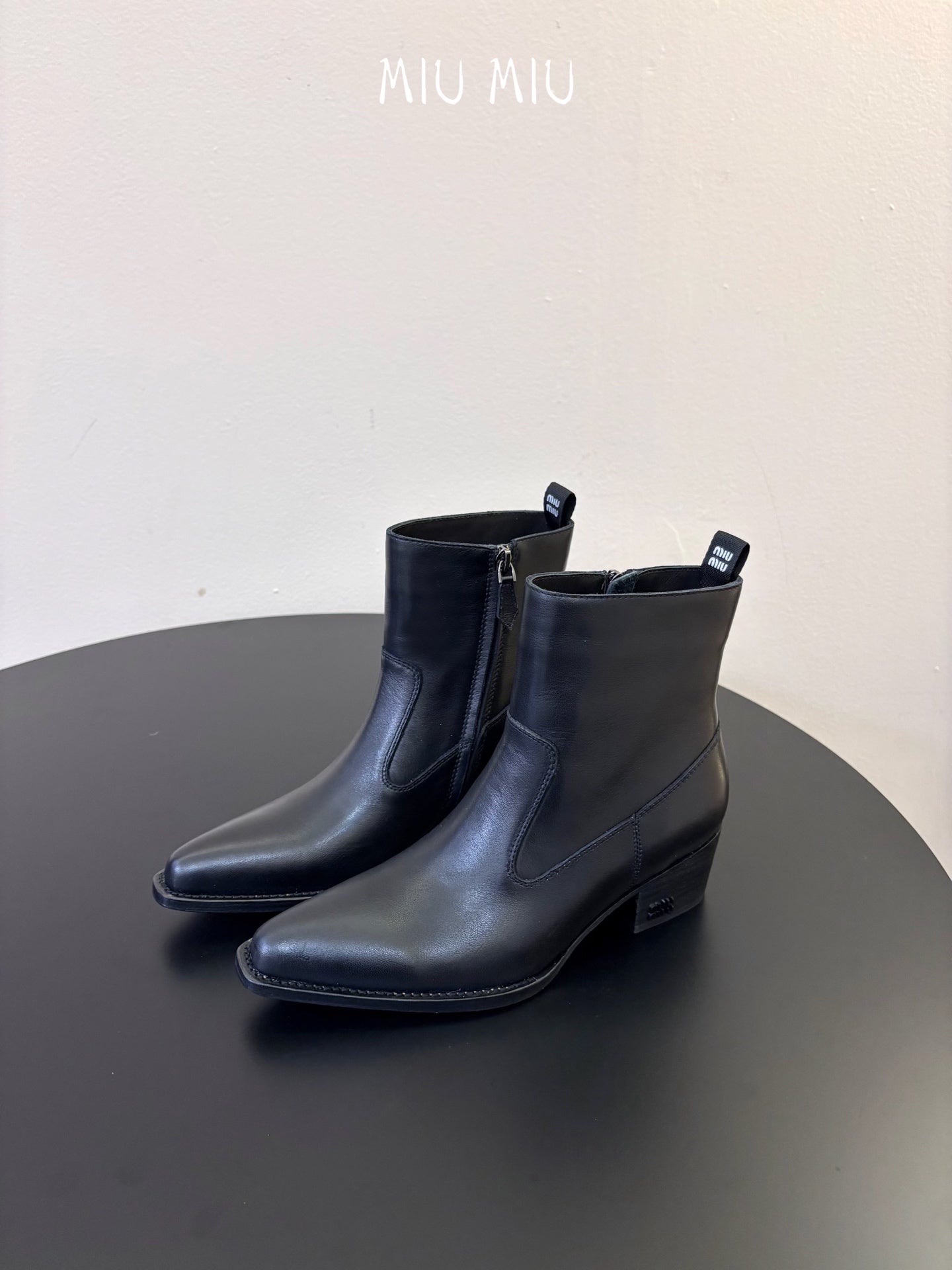 MIUMIU 26S WESTERN ANKLE BOOTS IN BLACK CALFSKIN