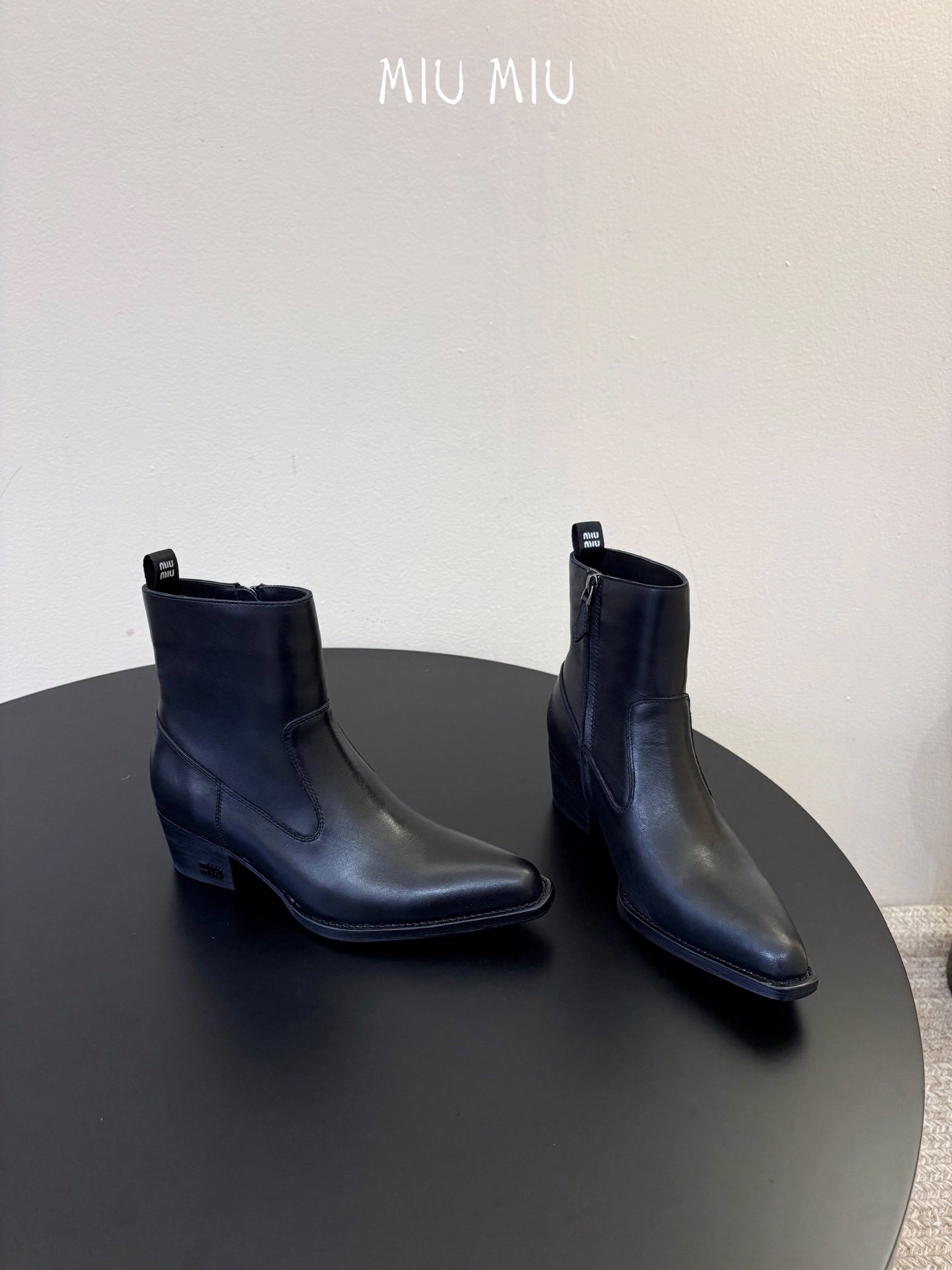 MIUMIU 26S WESTERN ANKLE BOOTS IN BLACK CALFSKIN