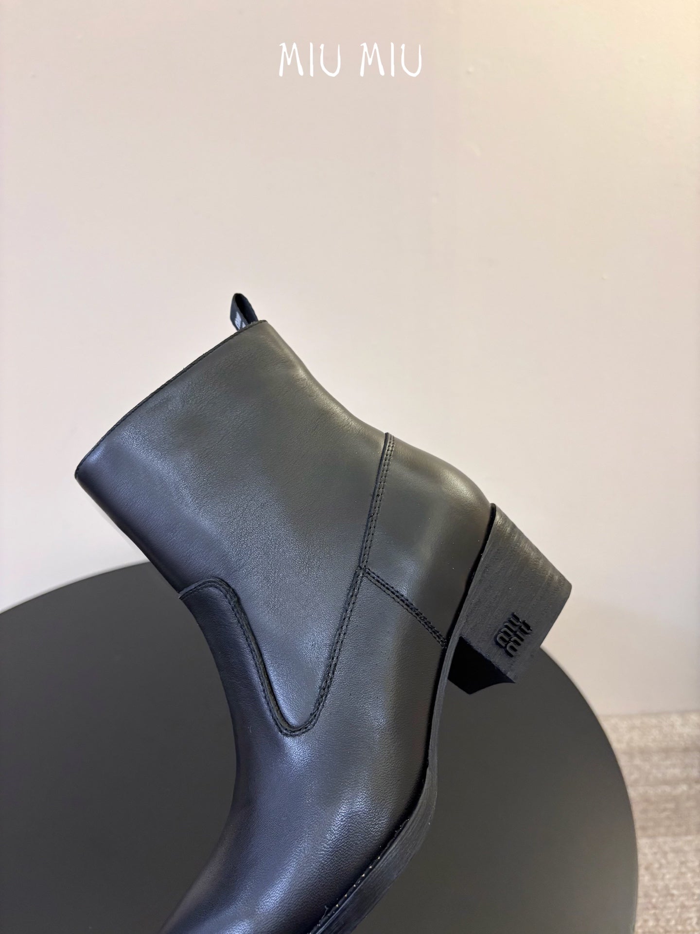MIUMIU 26S WESTERN ANKLE BOOTS IN BLACK CALFSKIN
