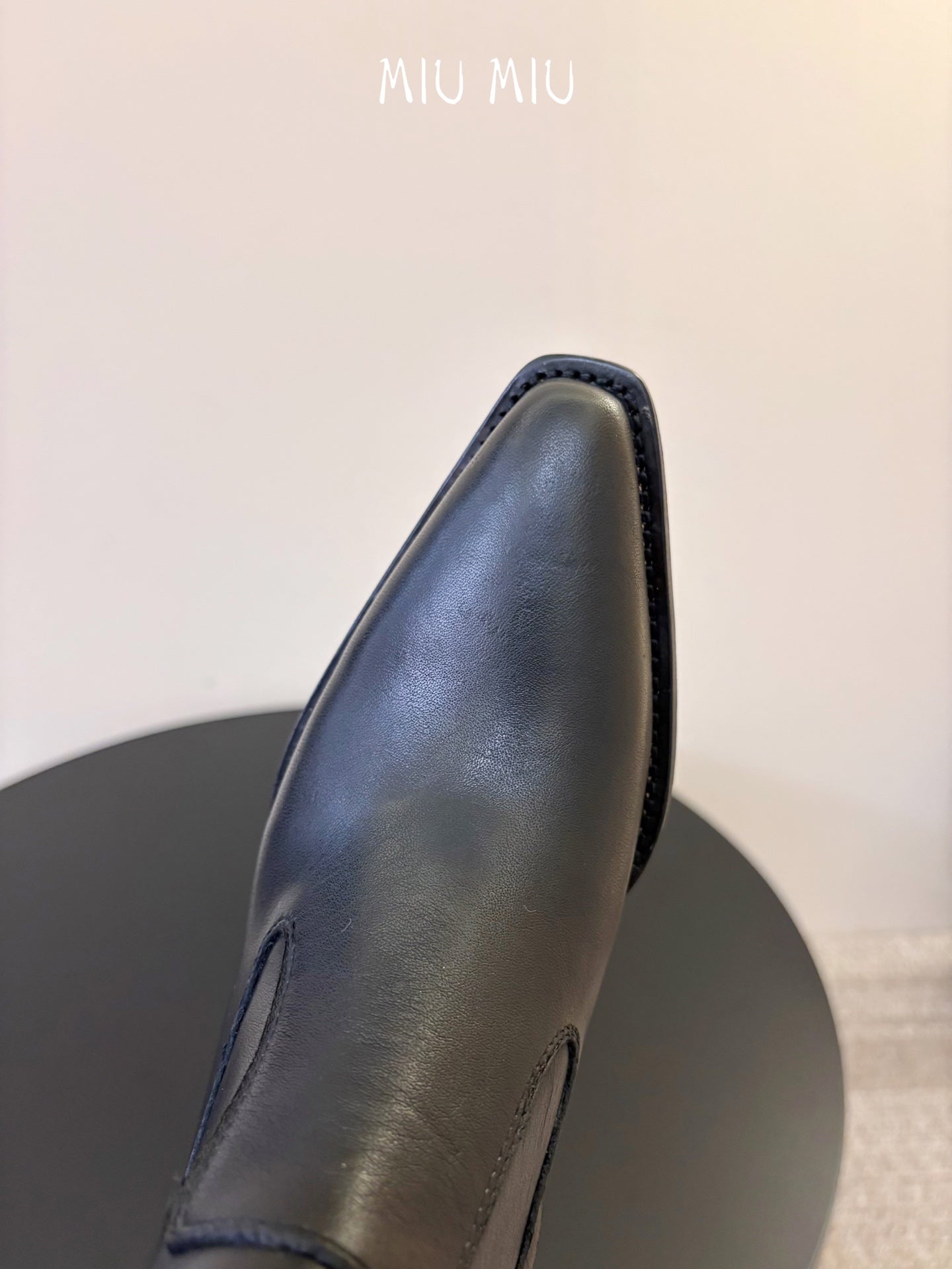 MIUMIU 26S WESTERN ANKLE BOOTS IN BLACK CALFSKIN