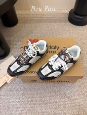 MIUMIU 26S PERFORATED SNEAKERS IN WHITE AND BLACK CALFSKIN