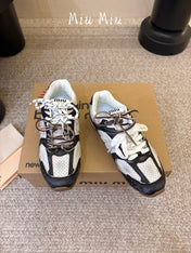 MIUMIU 26S PERFORATED SNEAKERS IN WHITE AND BLACK CALFSKIN