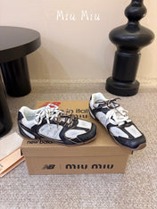 MIUMIU 26S PERFORATED SNEAKERS IN WHITE AND BLACK CALFSKIN