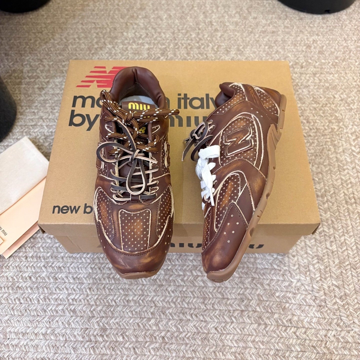 MIUMIU 26S PERFORATED SNEAKERS IN DARK BROWN CALFSKIN