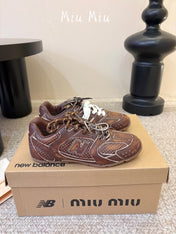 MIUMIU 26S PERFORATED SNEAKERS IN DARK BROWN CALFSKIN