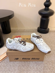MIUMIU 26S PERFORATED SNEAKERS IN CREAM WHITE CALFSKIN