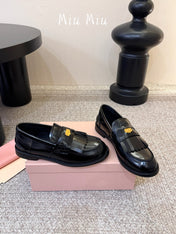 MIUMIU 26S FRINGE PENNY LOAFERS IN BLACK CALFSKIN