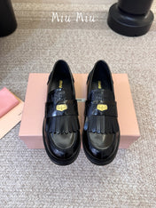 MIUMIU 26S FRINGE PENNY LOAFERS IN BLACK CALFSKIN