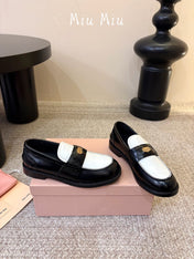 MIUMIU 26S COIN PENNY LOAFERS IN BLACK MIX WHITE CALFSKIN