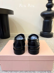 MIUMIU 26S COIN PENNY LOAFERS IN BLACK MIX WHITE CALFSKIN