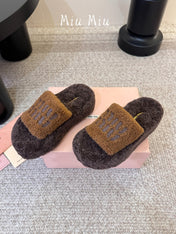 MIUMIU 26S PLATFORM SLIDES IN DARK BROWN SHEARLING