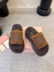 MIUMIU 26S PLATFORM SLIDES IN DARK BROWN SHEARLING