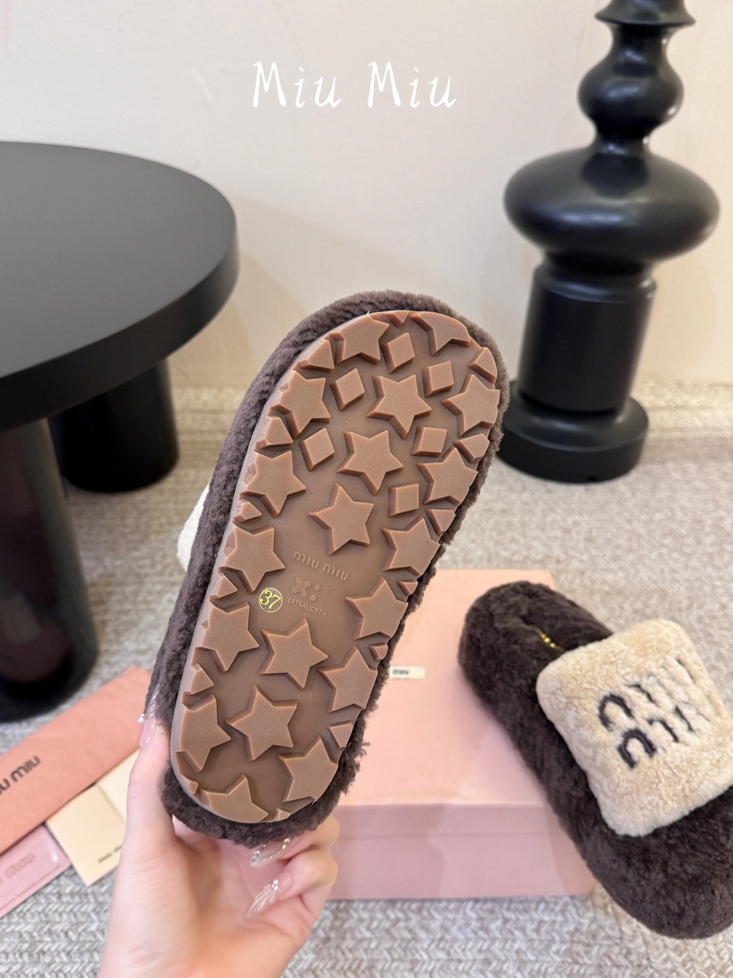 MIUMIU 26S PLATFORM SLIDES IN DARK BROWN AND BEIGE SHEARLING