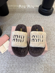 MIUMIU 26S PLATFORM SLIDES IN DARK BROWN AND BEIGE SHEARLING